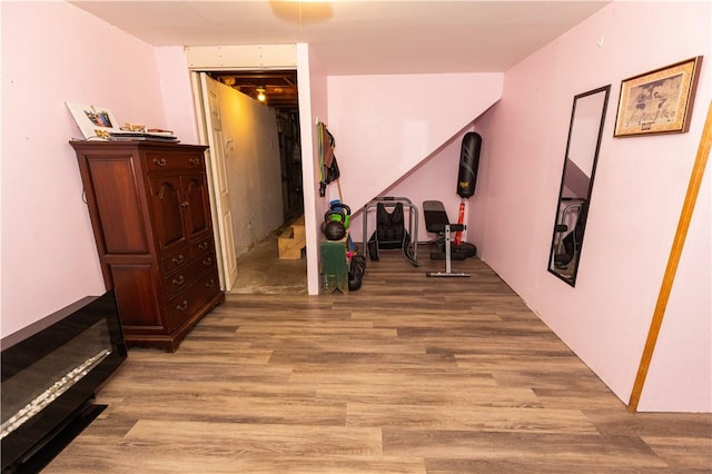 hallway with light hardwood / wood-style flooring