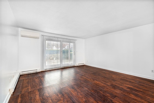 spare room featuring a wall mounted air conditioner, dark hardwood / wood-style floors, and baseboard heating