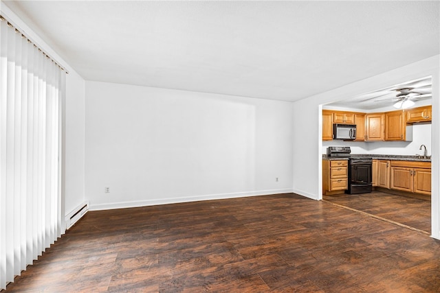 kitchen featuring ceiling fan, sink, dark wood-type flooring, a baseboard radiator, and electric stove