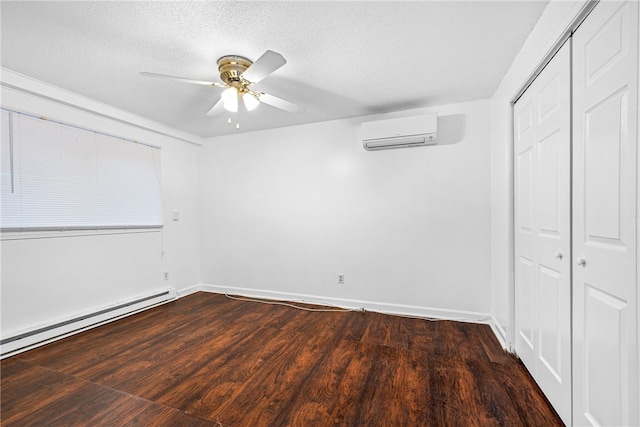 unfurnished bedroom featuring a closet, a wall mounted AC, ceiling fan, and dark hardwood / wood-style flooring