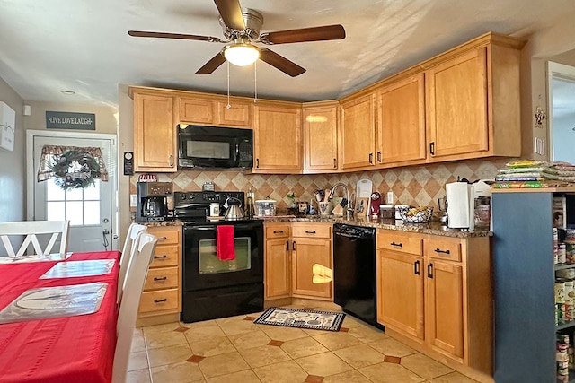 kitchen with ceiling fan, tasteful backsplash, dark stone counters, light tile patterned flooring, and black appliances