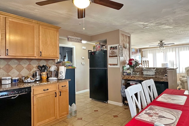 kitchen featuring decorative backsplash, light brown cabinets, light tile patterned flooring, and black appliances