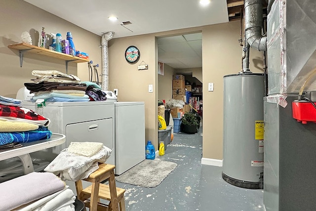 clothes washing area with independent washer and dryer, gas water heater, and heating unit