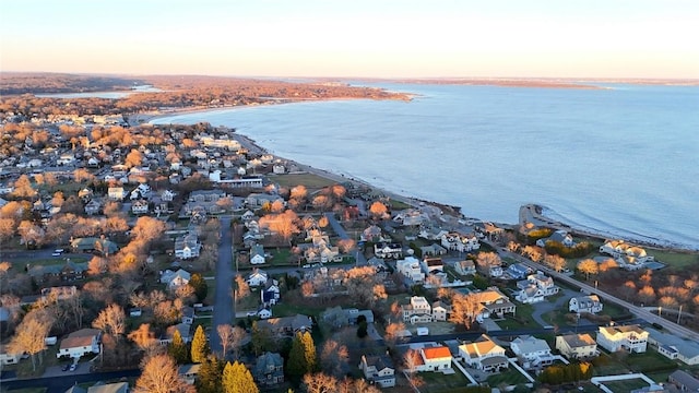 aerial view at dusk with a water view