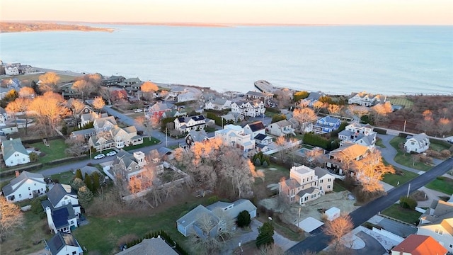 aerial view at dusk with a water view