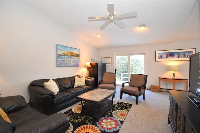 carpeted living room with ceiling fan and vaulted ceiling