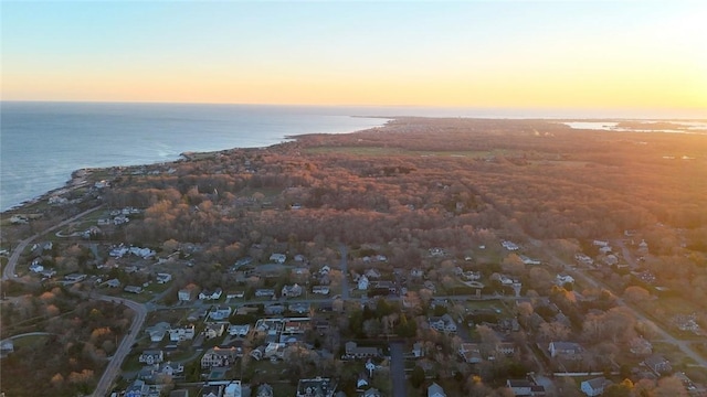 aerial view at dusk with a water view