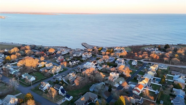 aerial view at dusk with a water view