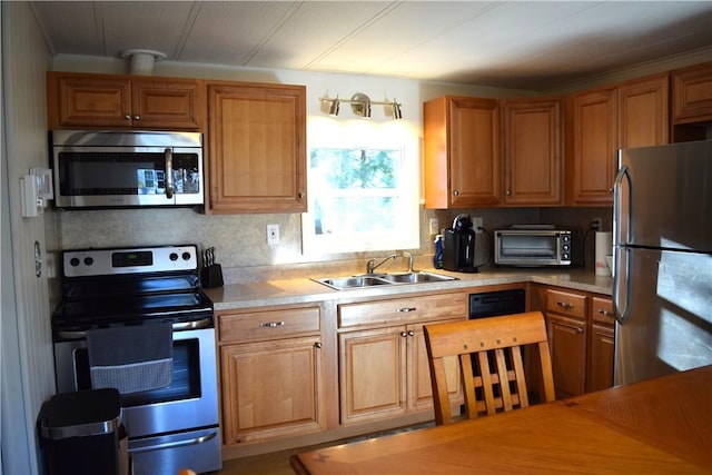 kitchen with decorative backsplash, sink, and appliances with stainless steel finishes