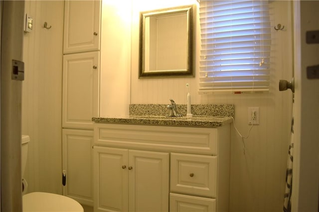 bathroom with vanity and toilet