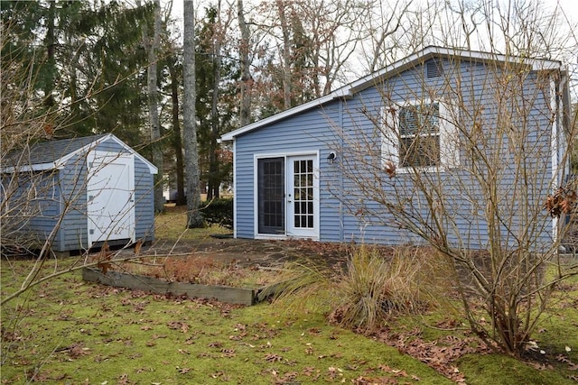 rear view of house with a storage unit