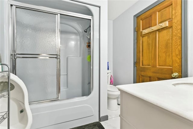 full bathroom featuring vanity, toilet, and enclosed tub / shower combo