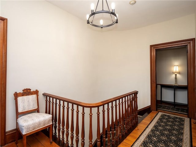 interior space featuring hardwood / wood-style floors and an inviting chandelier