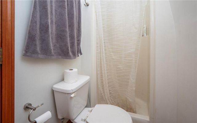 bathroom with toilet and walk in shower