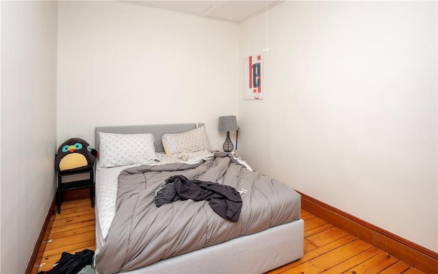 bedroom featuring hardwood / wood-style flooring