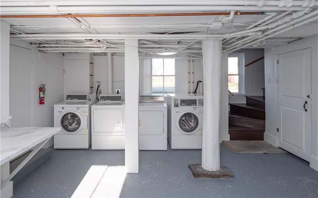 laundry room featuring washing machine and clothes dryer