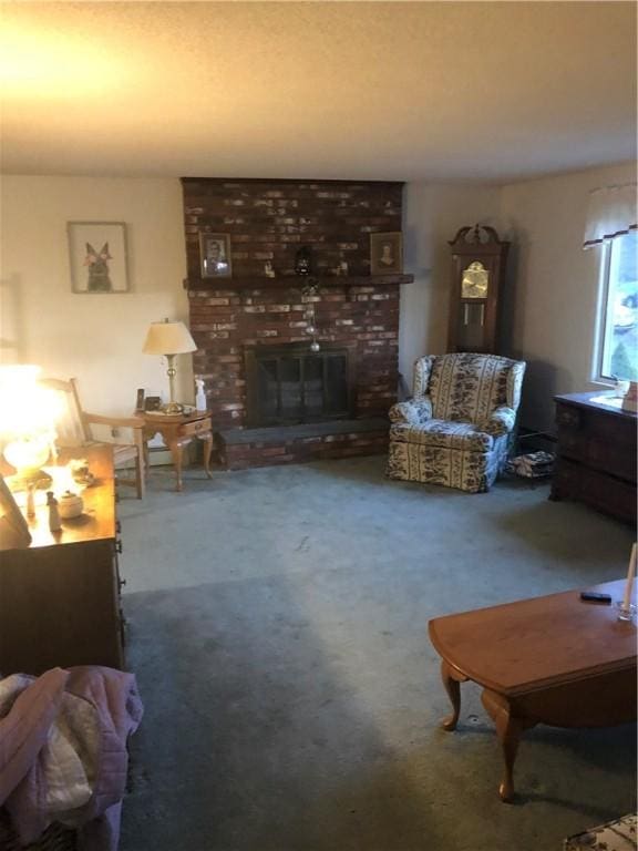 carpeted living room with a brick fireplace