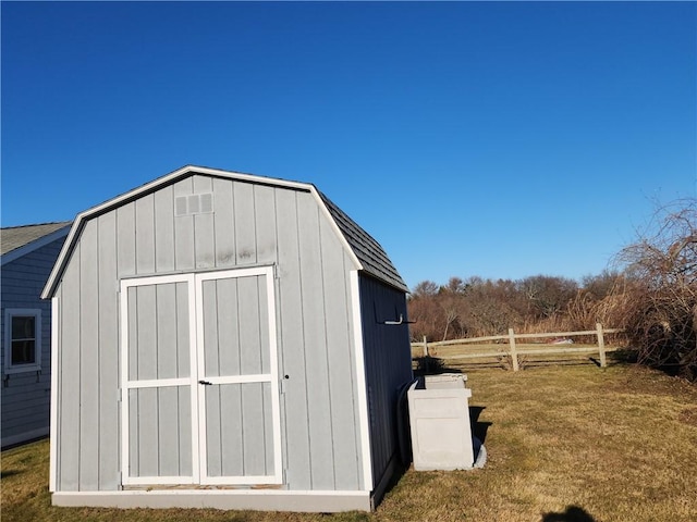 view of outdoor structure featuring a lawn