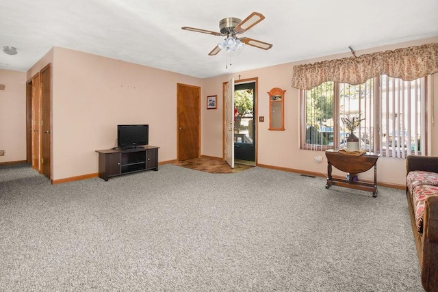 living room with carpet flooring and ceiling fan