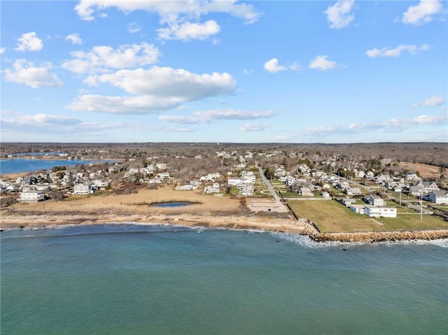 bird's eye view with a water view and a beach view