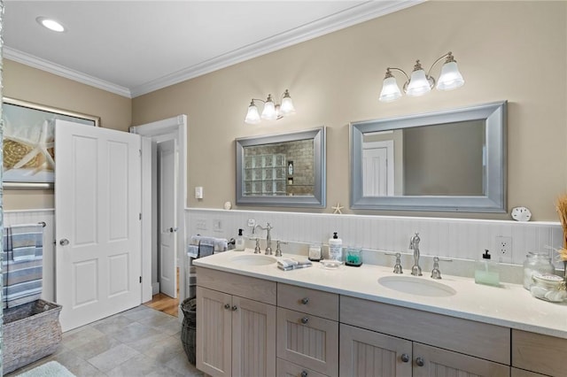 bathroom featuring crown molding and vanity