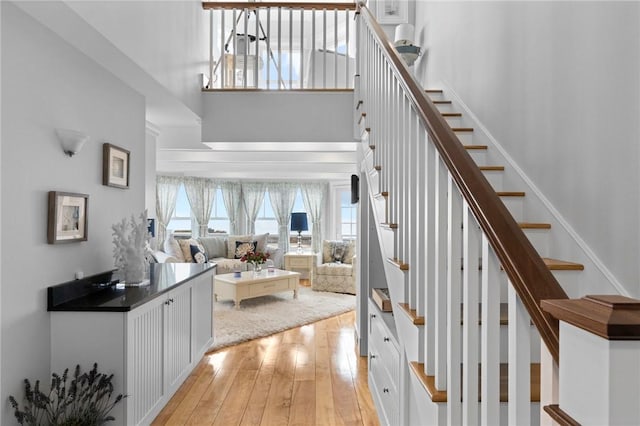 stairs featuring hardwood / wood-style flooring