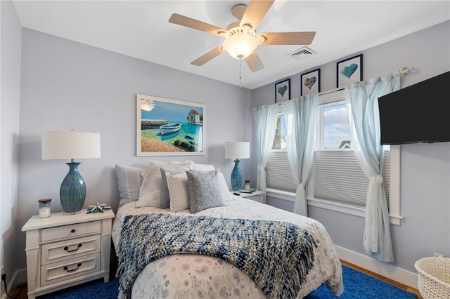 bedroom featuring hardwood / wood-style floors and ceiling fan