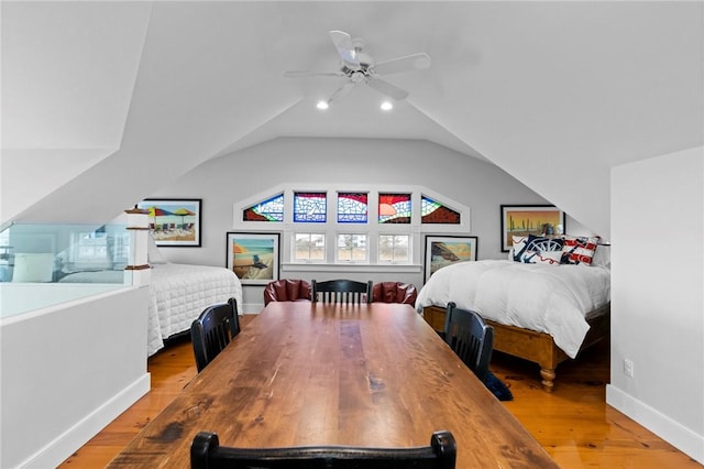 bedroom featuring wood-type flooring, vaulted ceiling, and ceiling fan