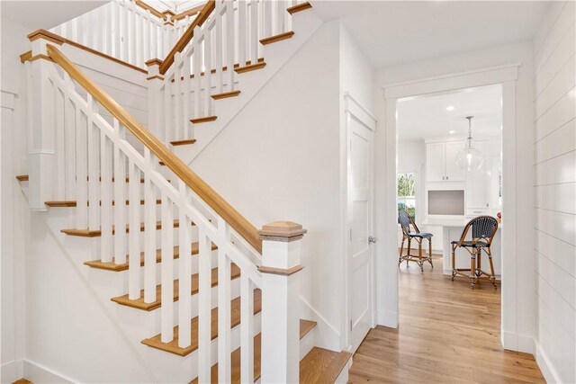 staircase featuring hardwood / wood-style flooring