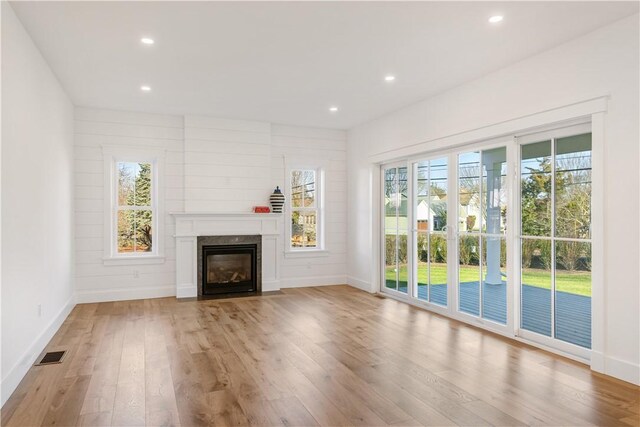 unfurnished living room featuring light wood-type flooring