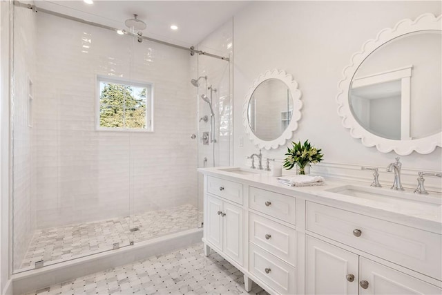 bathroom with an enclosed shower and vanity