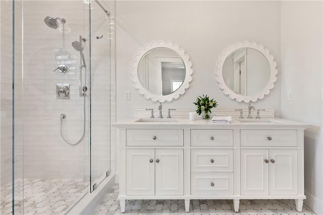 bathroom featuring vanity and an enclosed shower