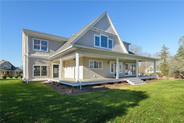 rear view of property with a lawn and covered porch