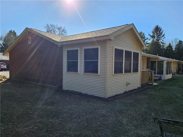 view of home's exterior featuring a yard