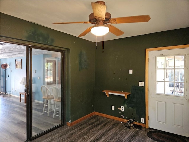 entryway featuring ceiling fan and dark hardwood / wood-style flooring