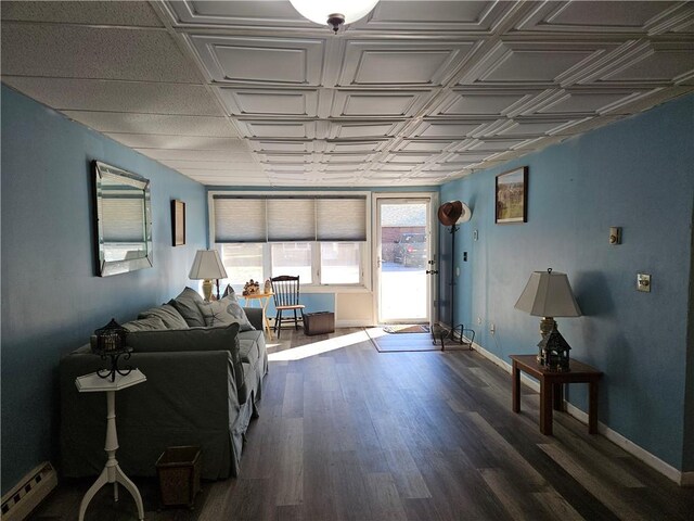 living room featuring dark hardwood / wood-style flooring and baseboard heating