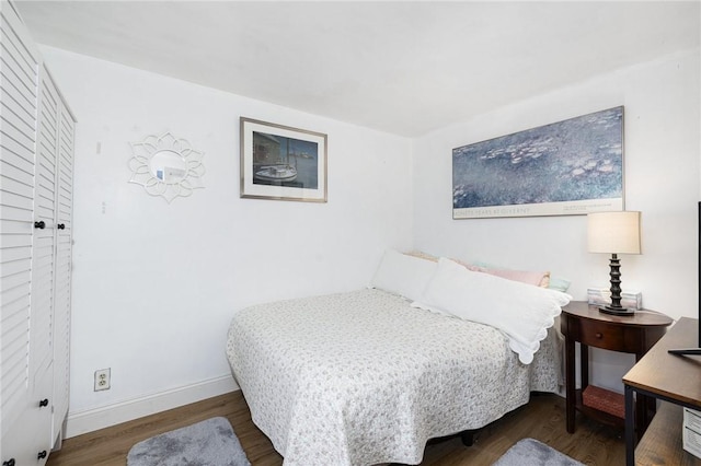 bedroom featuring dark hardwood / wood-style flooring