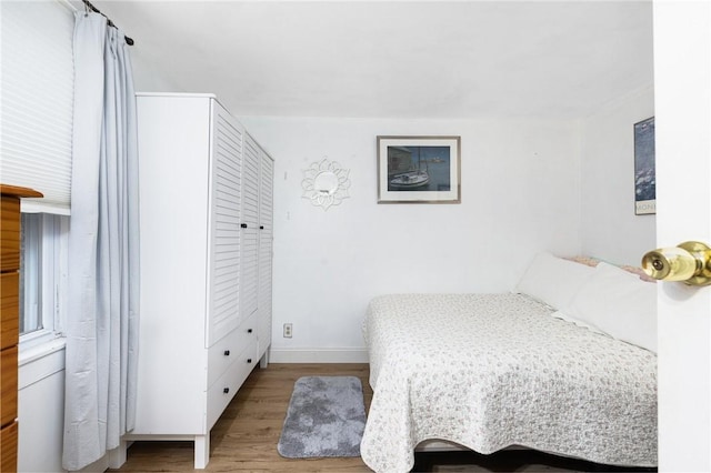 bedroom with light hardwood / wood-style flooring