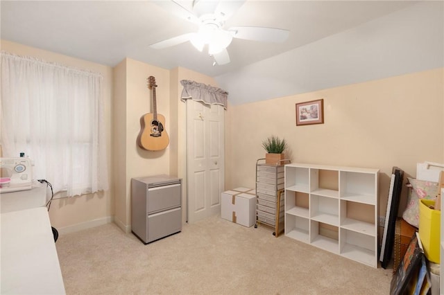 interior space with ceiling fan