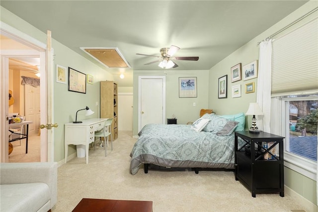 bedroom featuring ceiling fan and light carpet