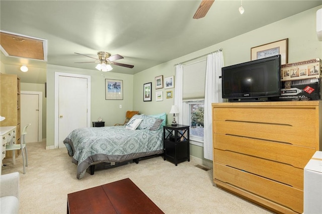 bedroom with ceiling fan and light carpet