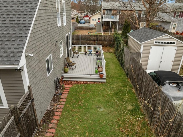 view of yard featuring a shed and a deck