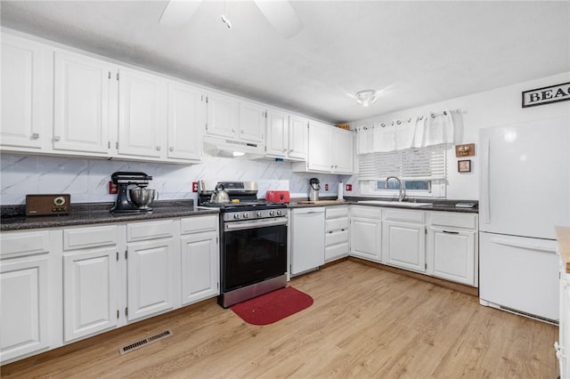 kitchen featuring ventilation hood, white cabinetry, white appliances, and sink