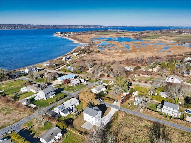 drone / aerial view with a residential view and a water view