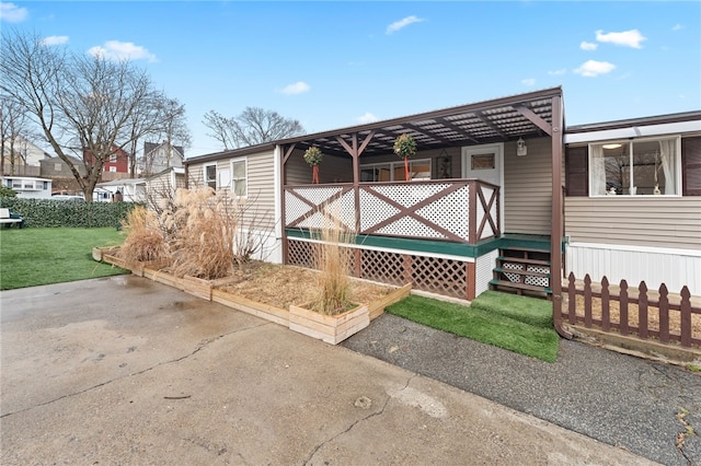 view of side of home with a lawn