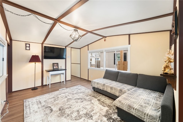 living room with vaulted ceiling with beams, hardwood / wood-style floors, and a notable chandelier