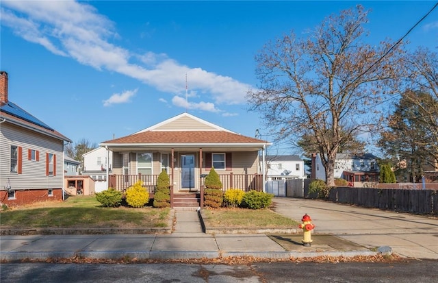 bungalow-style home featuring a front yard and a porch