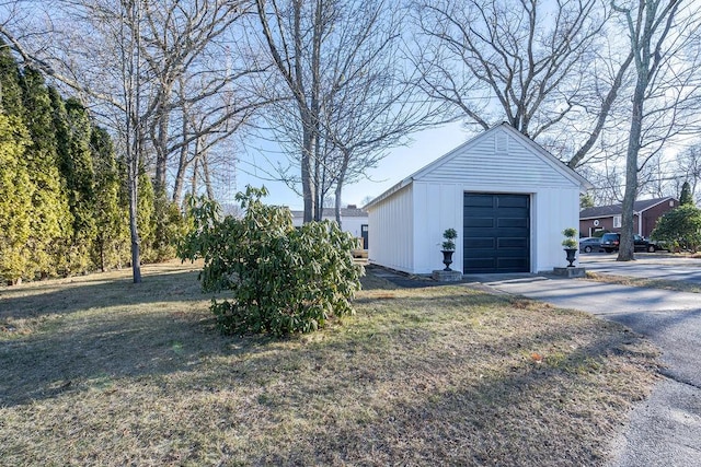 garage featuring a lawn