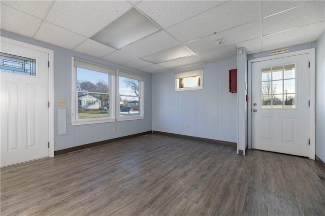 entrance foyer with a paneled ceiling and dark wood-type flooring