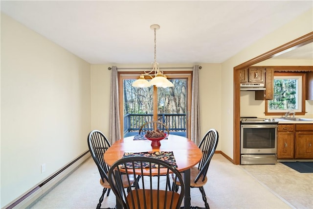 carpeted dining area with an inviting chandelier, baseboard heating, and sink